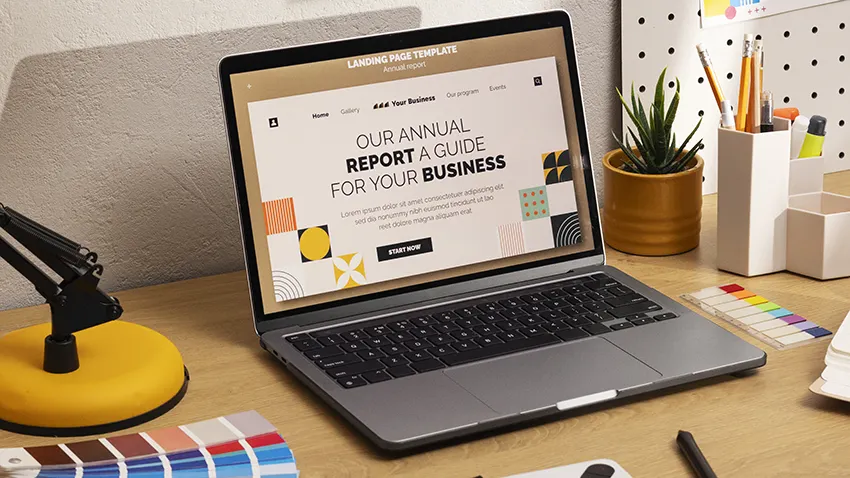 a laptop on table with website template on it